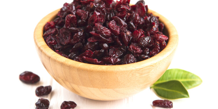 Dried cranberries on a old wooden table
