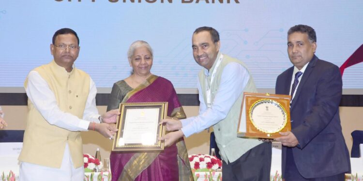 Union Finance Minister Nirmala Sitharaman confers Dr N Kamakodi, Managing Director and Chief Executive Officer of City Union Bank with the Digital Payments Award in New Delhi on Wednesday. CUB has received the award for the second position among private sector banks.